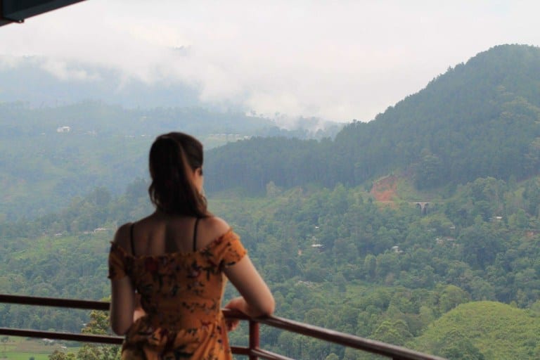 girl look over tea plantation sri lanka