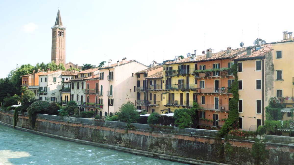 colorful houses verona along river