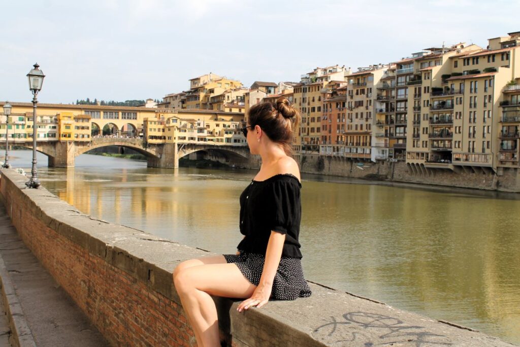 lady sitting on wall ponte veccho 2 days in florence