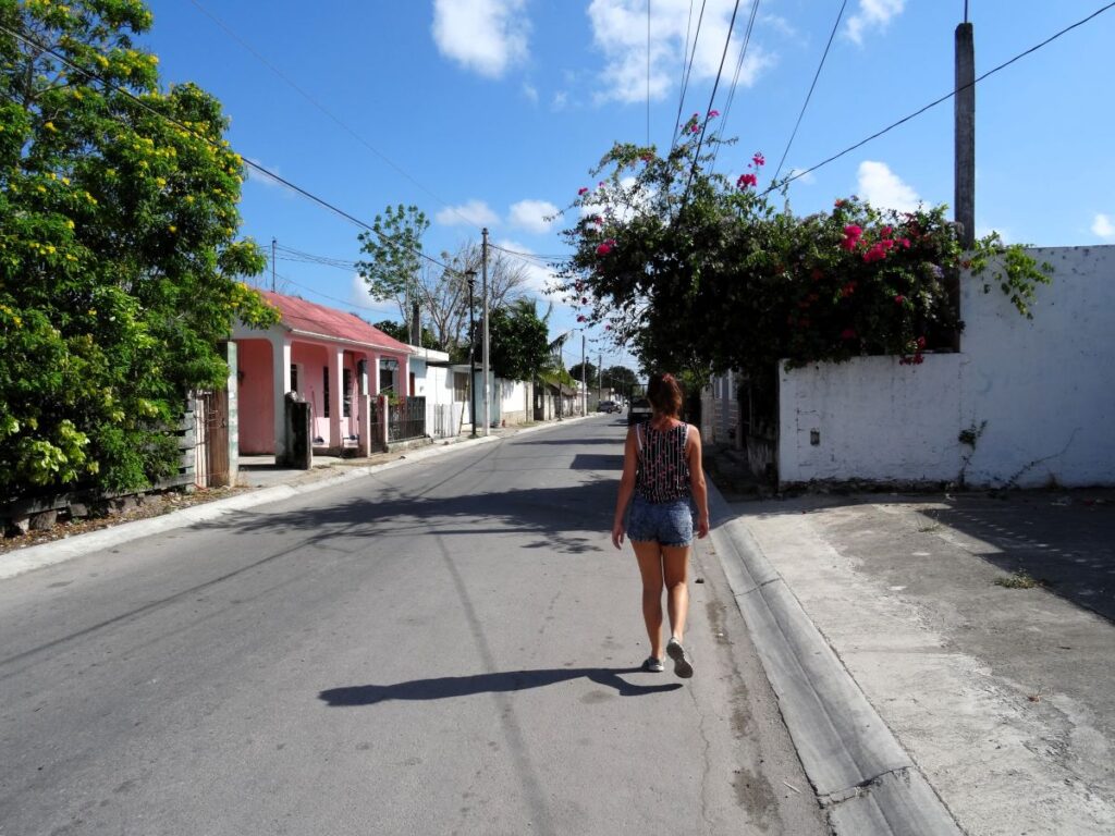 lady walking street bacalar