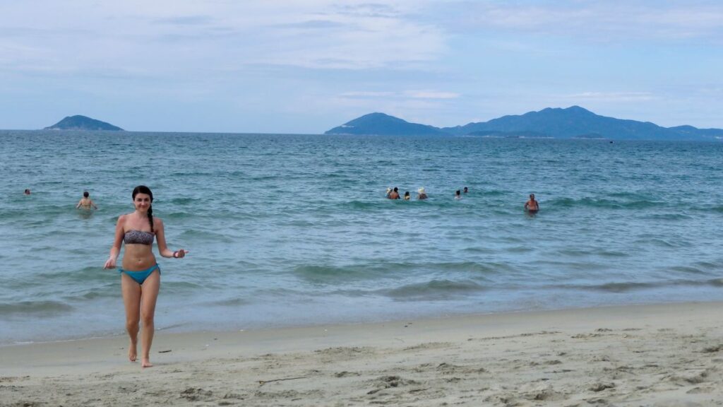 lady swimming beach hoi an