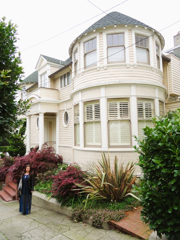 lady posing outside mrs doubtfire house