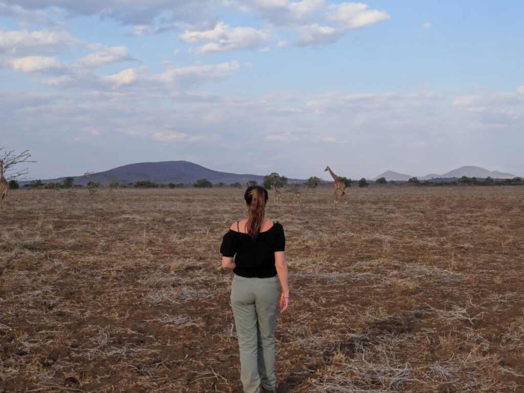 lady on sunset walking safari amboseli kenya