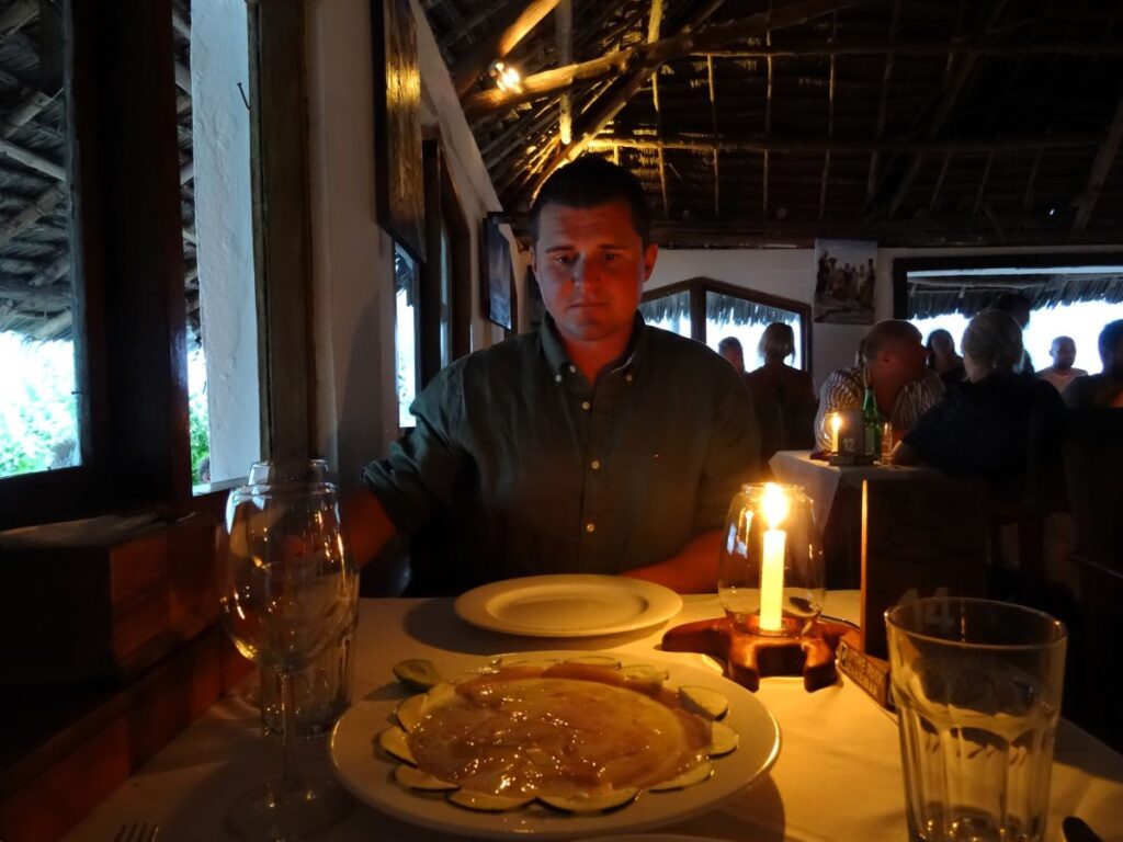man at rock restaurant zanzibar