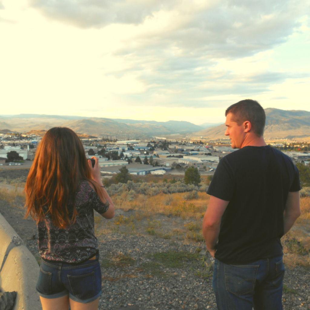 couple photographing sunset in Kamloops Canada