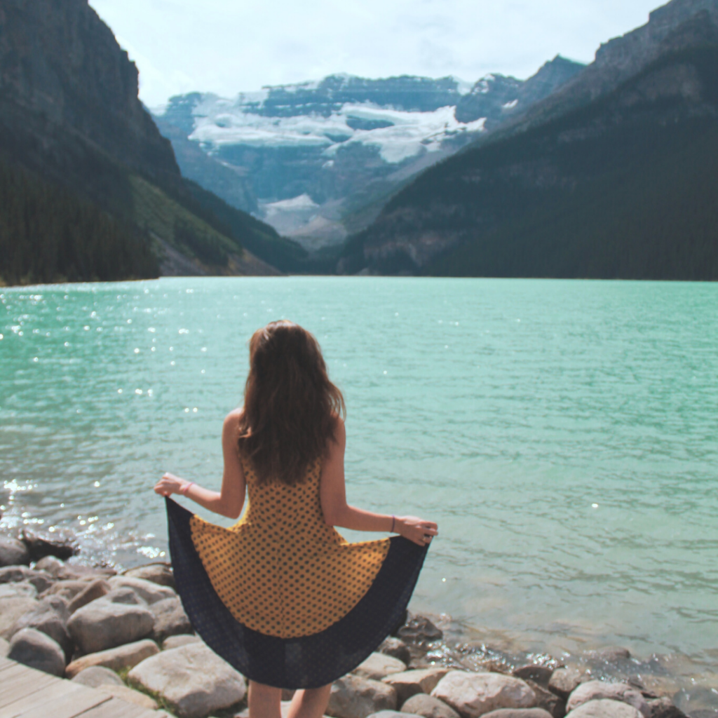 girl posing at lake louise in the summer
